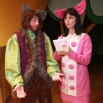 Dan Chevalier as Alexander T. Wolf & Ashley Laverty as Magill in THE TRUE STORY OF THE THREE LITTLE PIGS