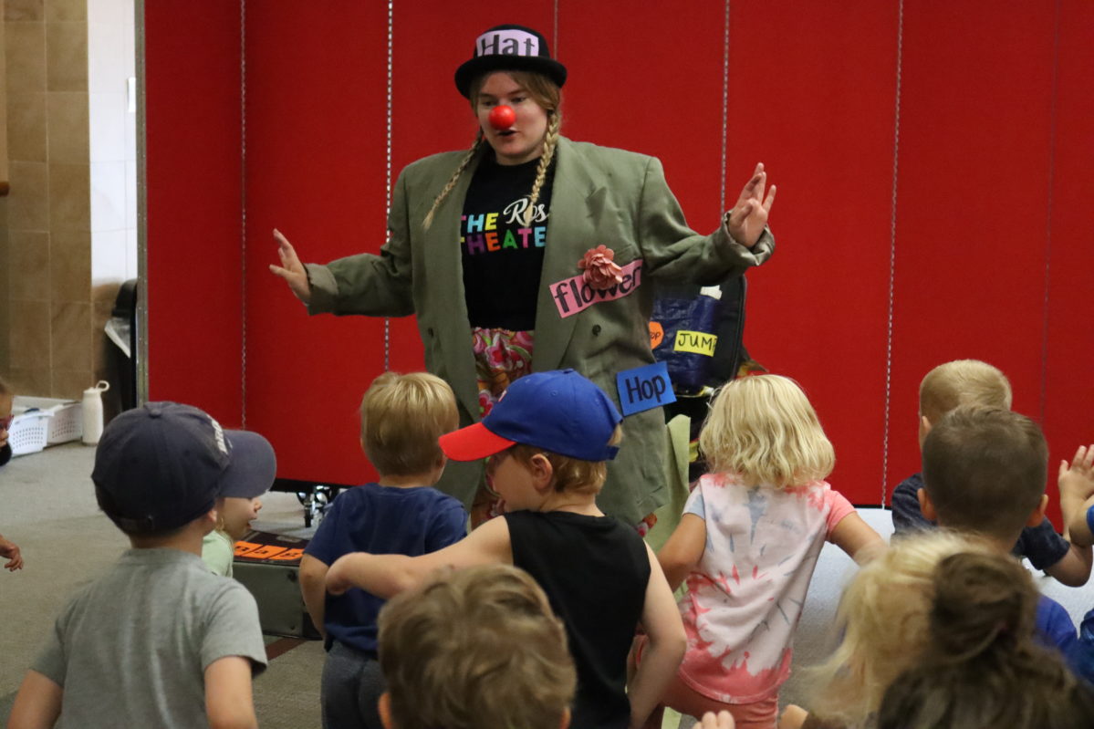 A costumed Rose Teaching Artist performs a role in a Touring Show at a local school.