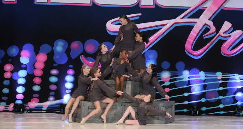 Rose Dance Project members onstage performing a routine at a competition.