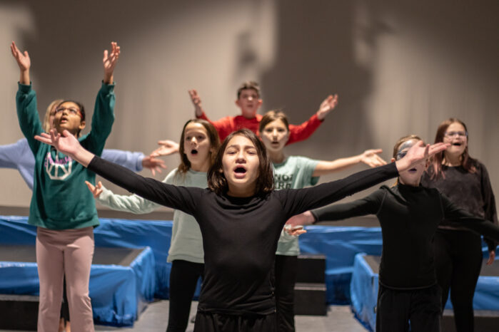 Students sing during a class at The Rose Studios